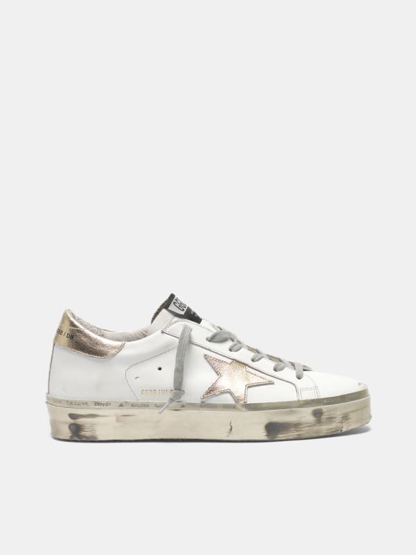 white sneakers with gold stars