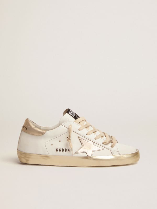 Super-Star sneakers with gold sparkle foxing and metal stud lettering 