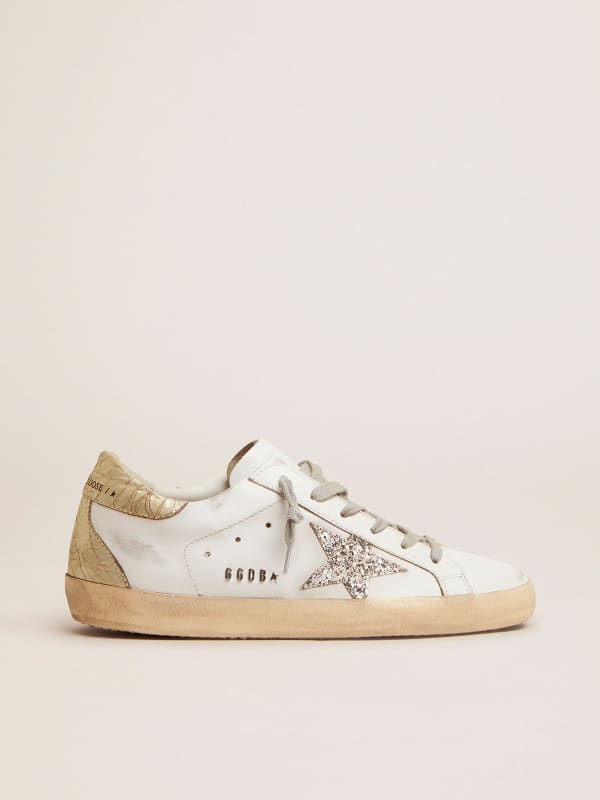 Super-Star sneakers with silver glitter star and glossy gold leather 