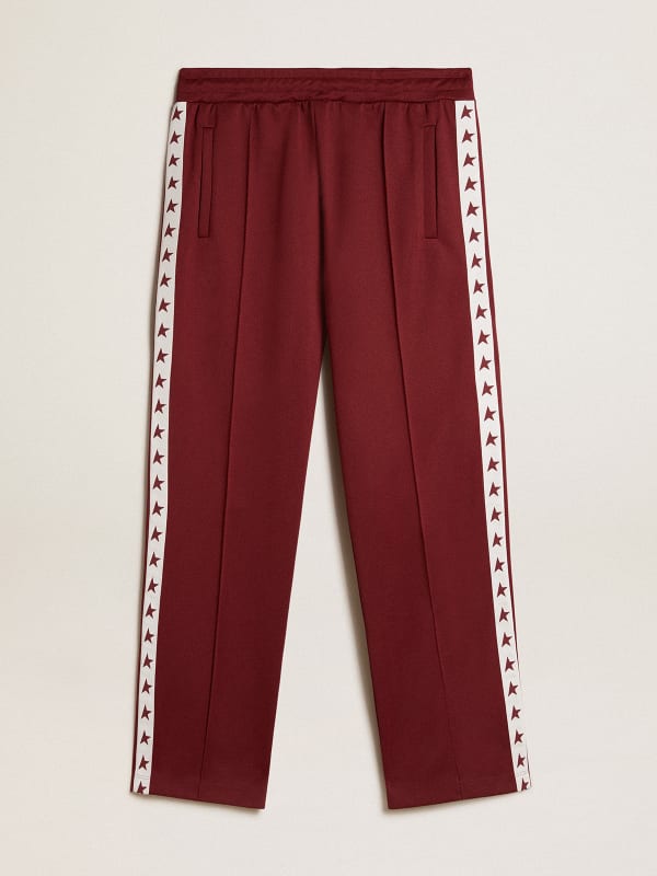 Men’s burgundy joggers with stars on the sides | Golden Goose