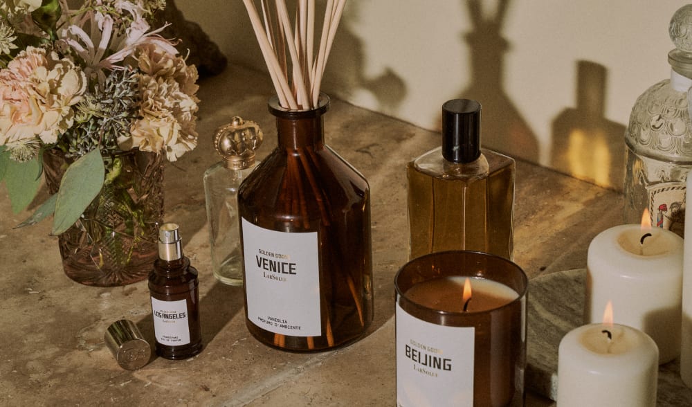 Venice-Essence-Vanilla-Home-fragrance-close-to-some-scented-candles-and-some-flowers