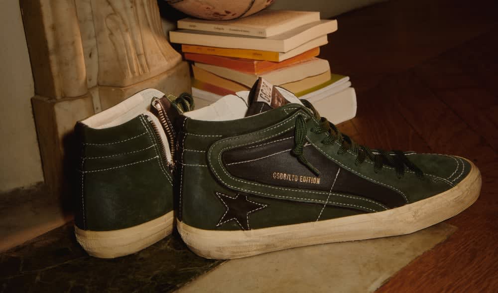 Slide-LTD-sneakers-in-green-suede-close-to-books