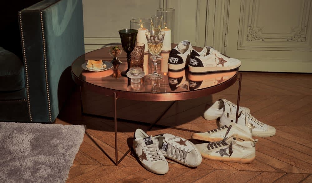 white-sneakers-under-and-on-table-in-a-victorian-style-room