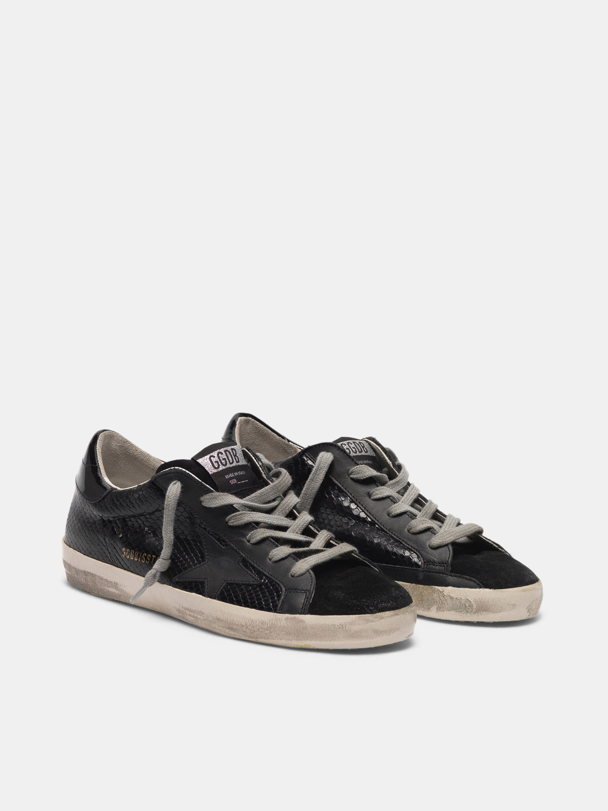 superstar sneakers in total black suede and snakeskin print leather