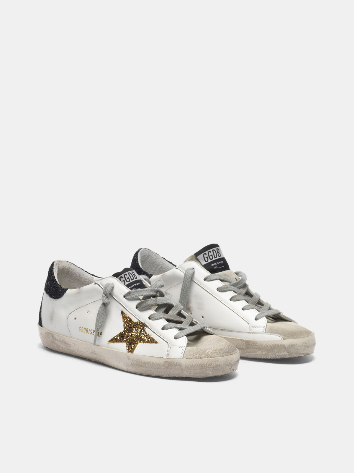 gold star and glittery black heel tab 
