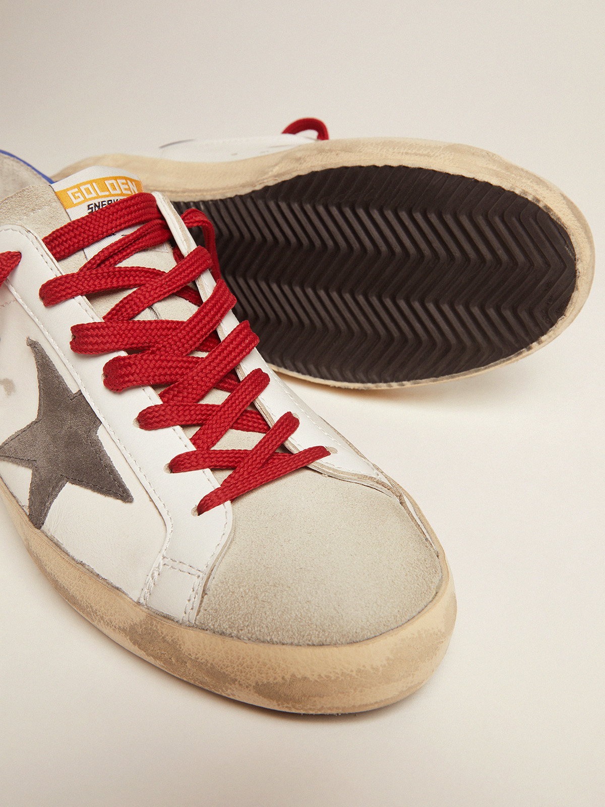 Super-Star sneakers with blue heel tab and red laces | Golden Goose