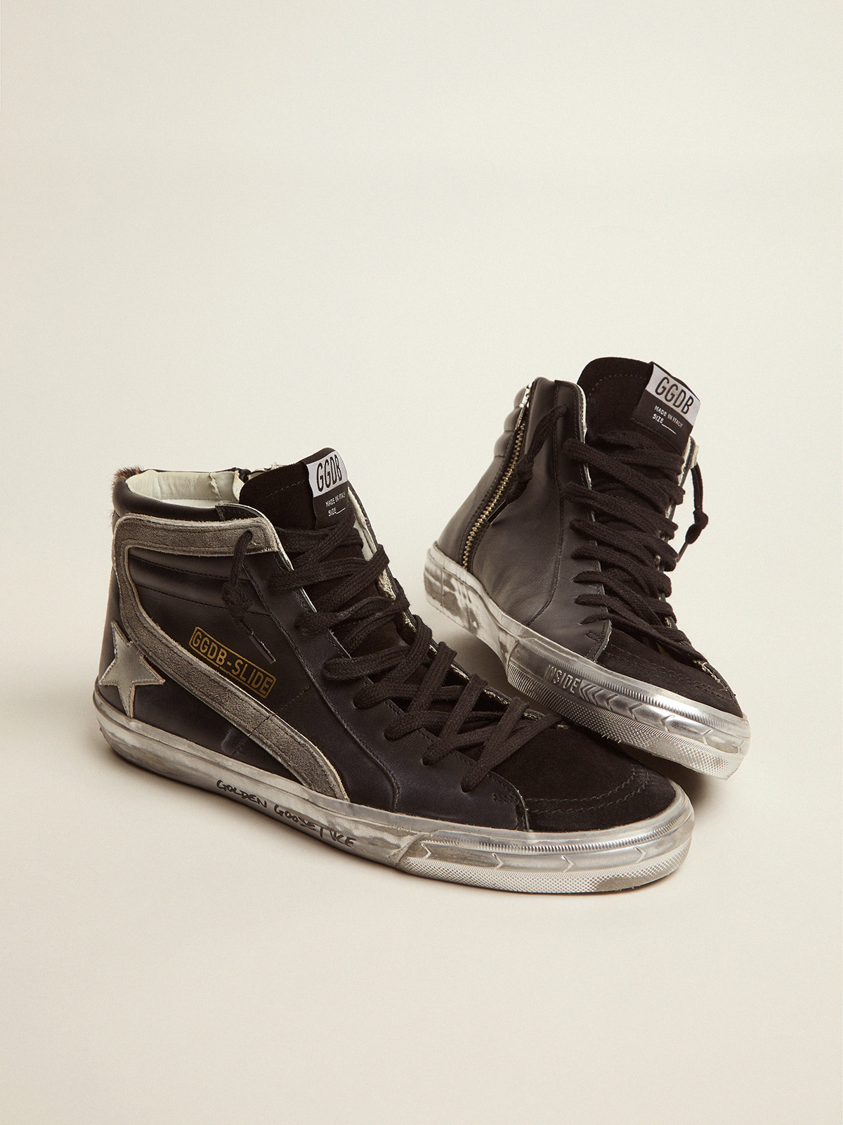 Slide sneakers in black leather with leopard-print pony skin heel tab |  Golden Goose