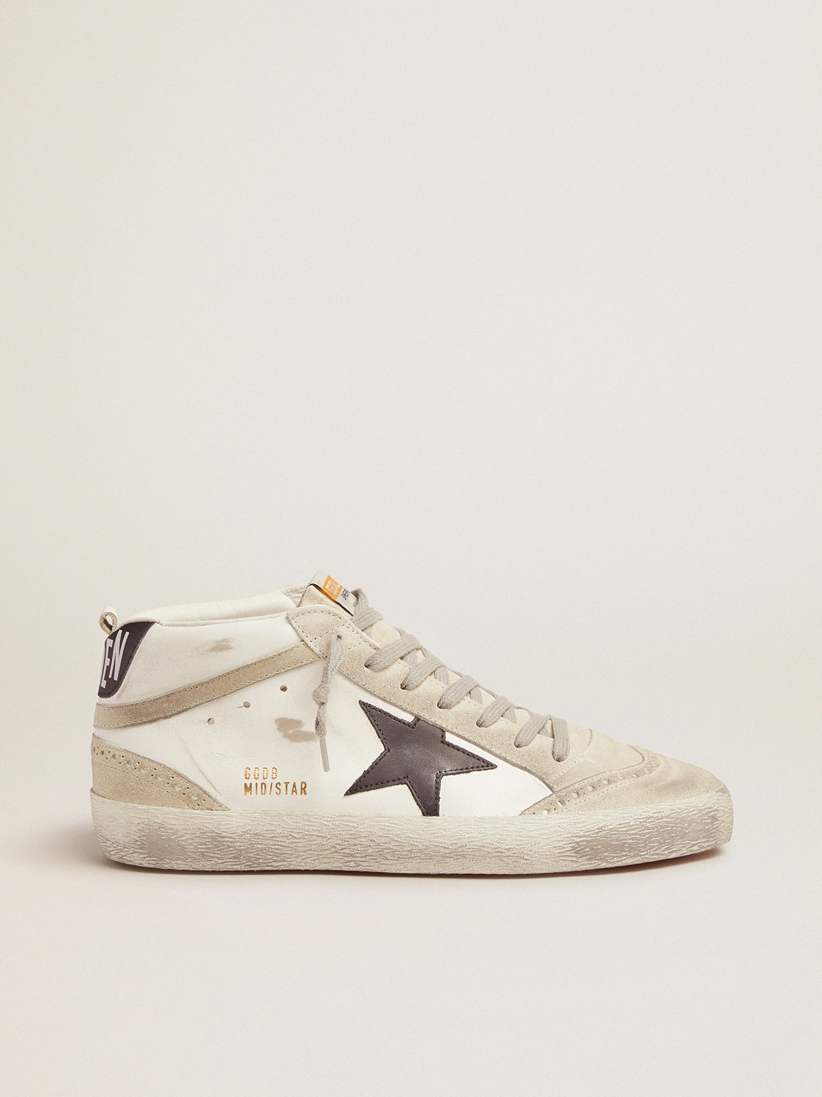 White sneakers with gold 2024 stars