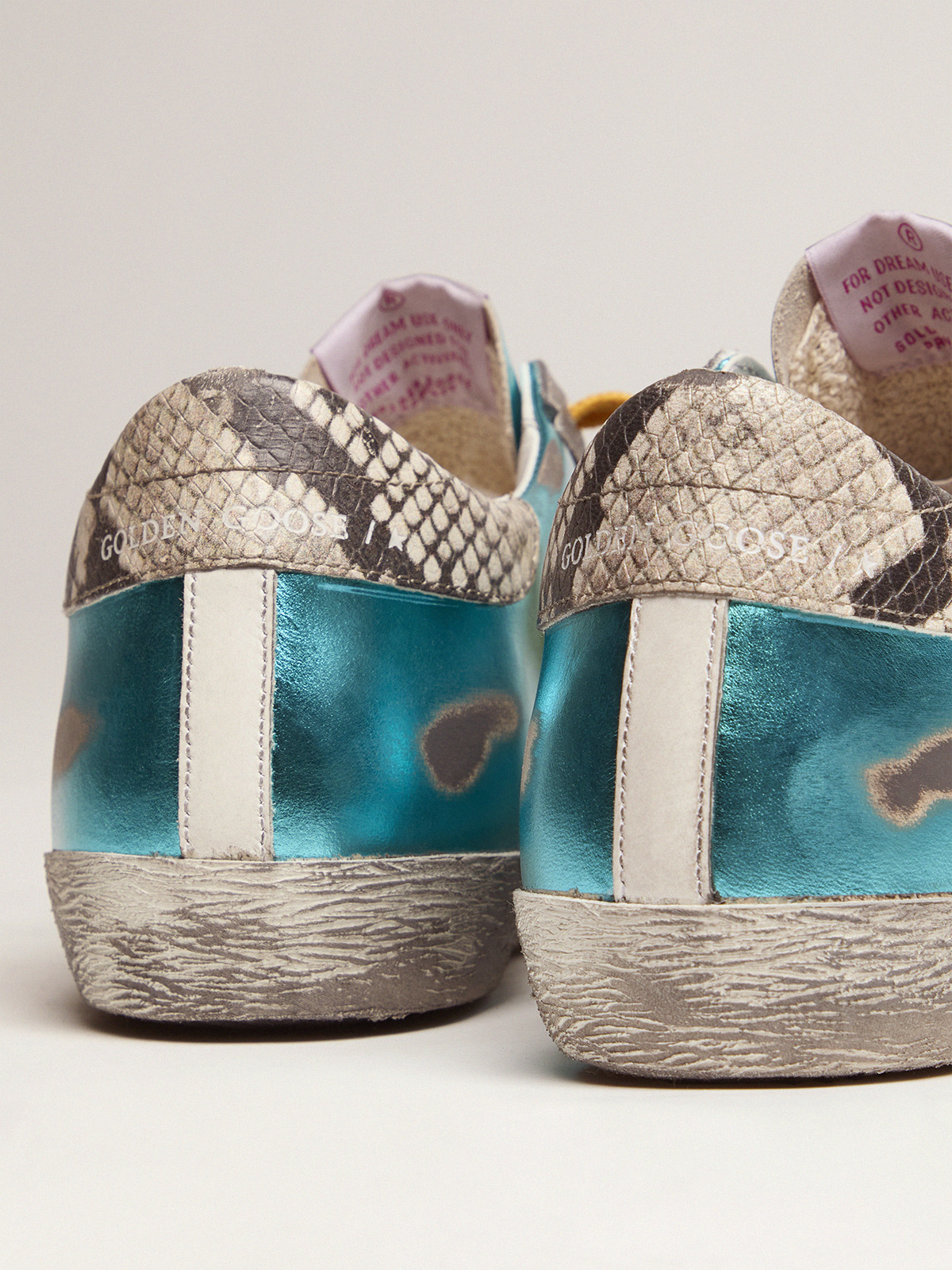 Turquoise green laminated Super-Star LTD sneakers with snake-print heel tab  | Golden Goose