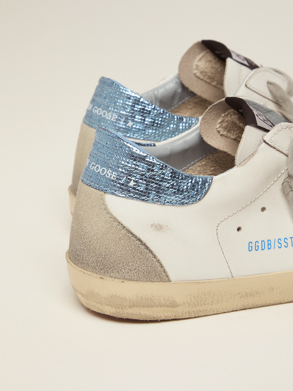 White Super-Star LTD sneakers with blue laminated heel tab | Golden Goose