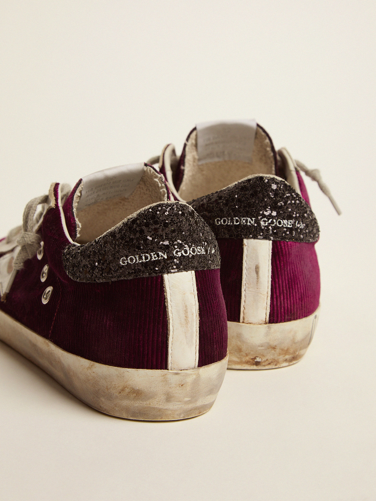 Super Star sneakers in raspberry red velvet and black glitter heel