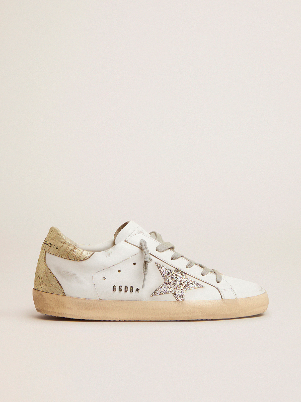 Super-Star sneakers with silver glitter star and glossy gold leather heel  tab | Golden Goose