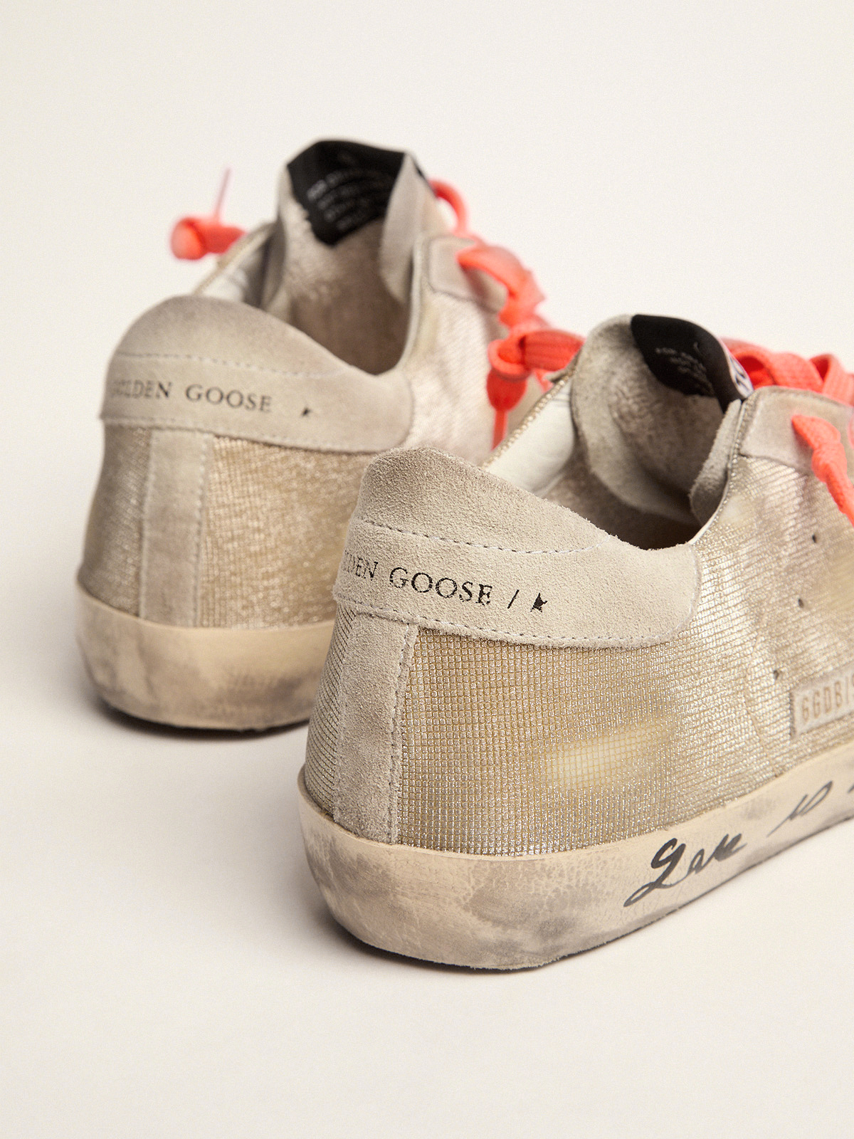 Gold-colored Super-Star sneakers with checkered pattern and handwriting |  Golden Goose