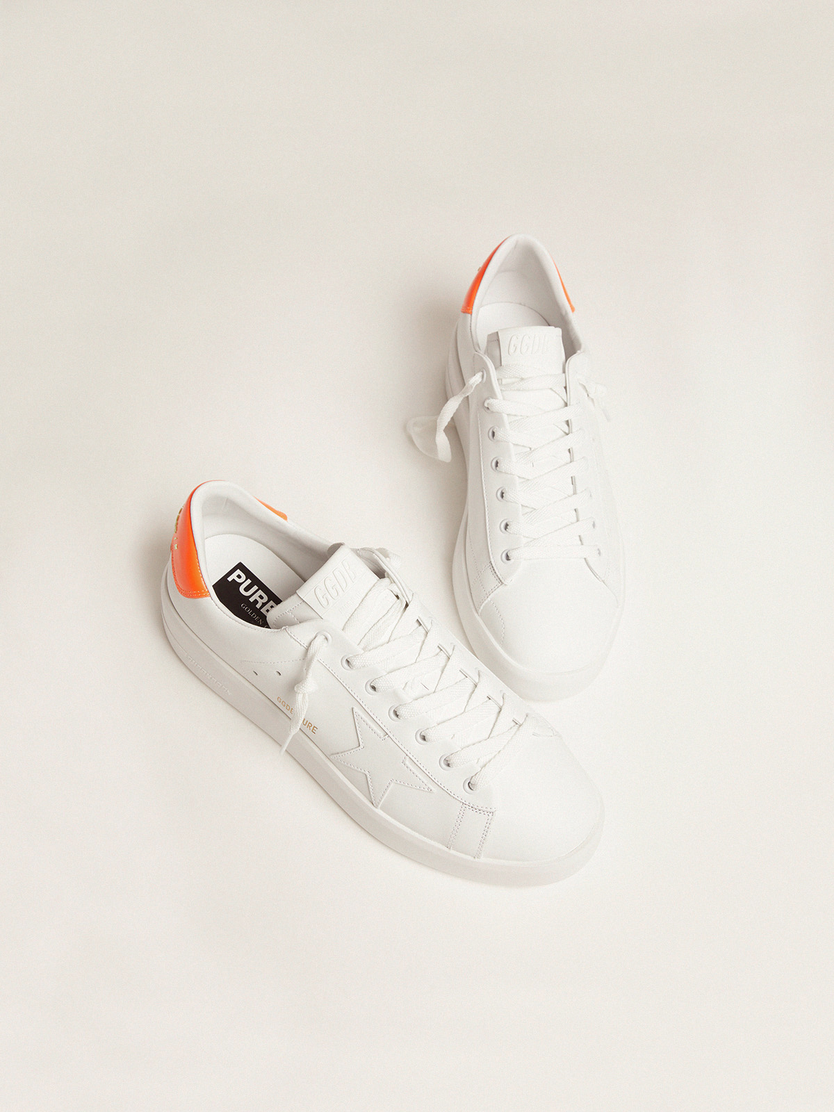 White Purestar sneakers with fluorescent orange heel tab | Golden 