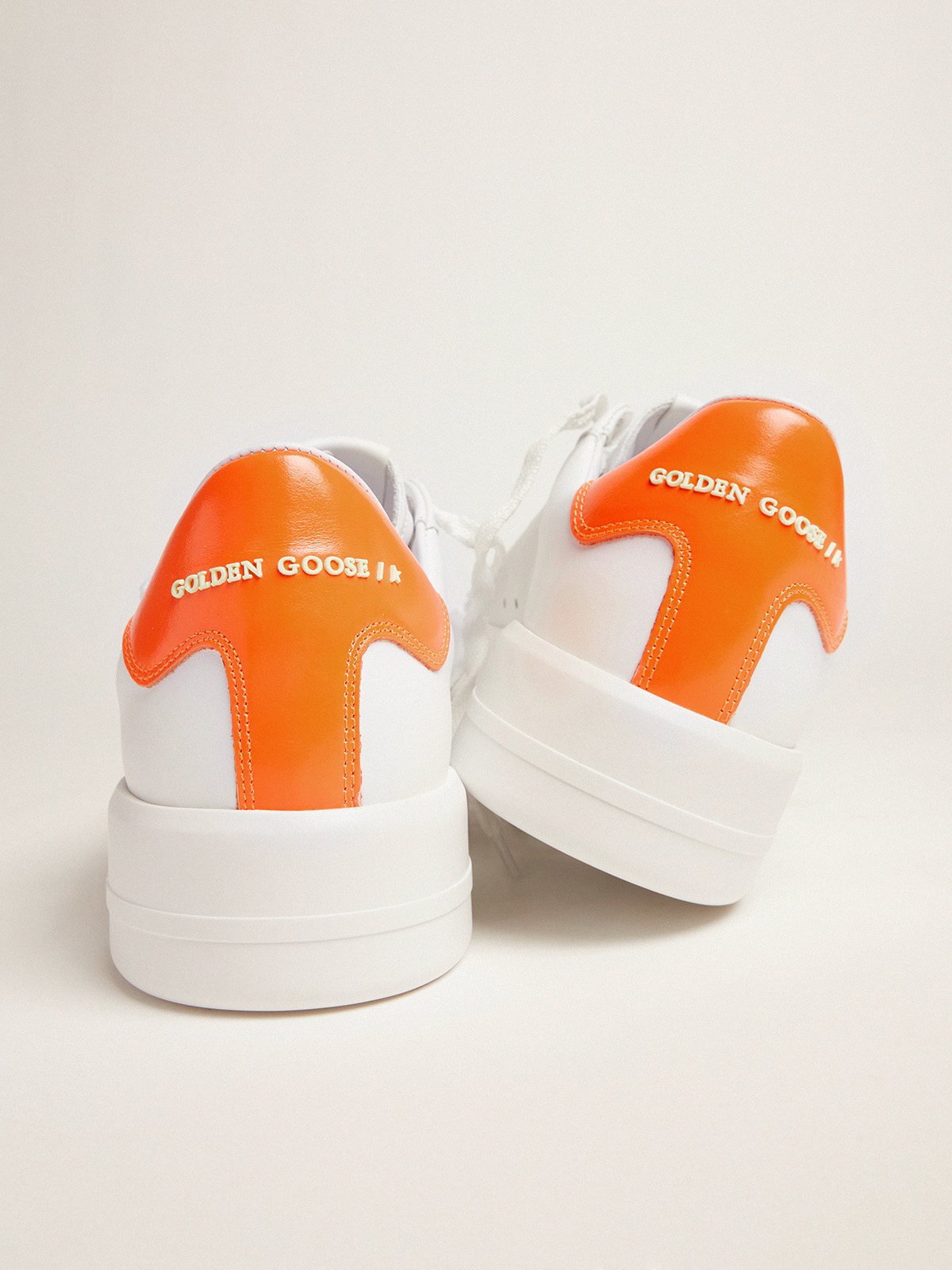 White Purestar sneakers with fluorescent orange heel tab | Golden 