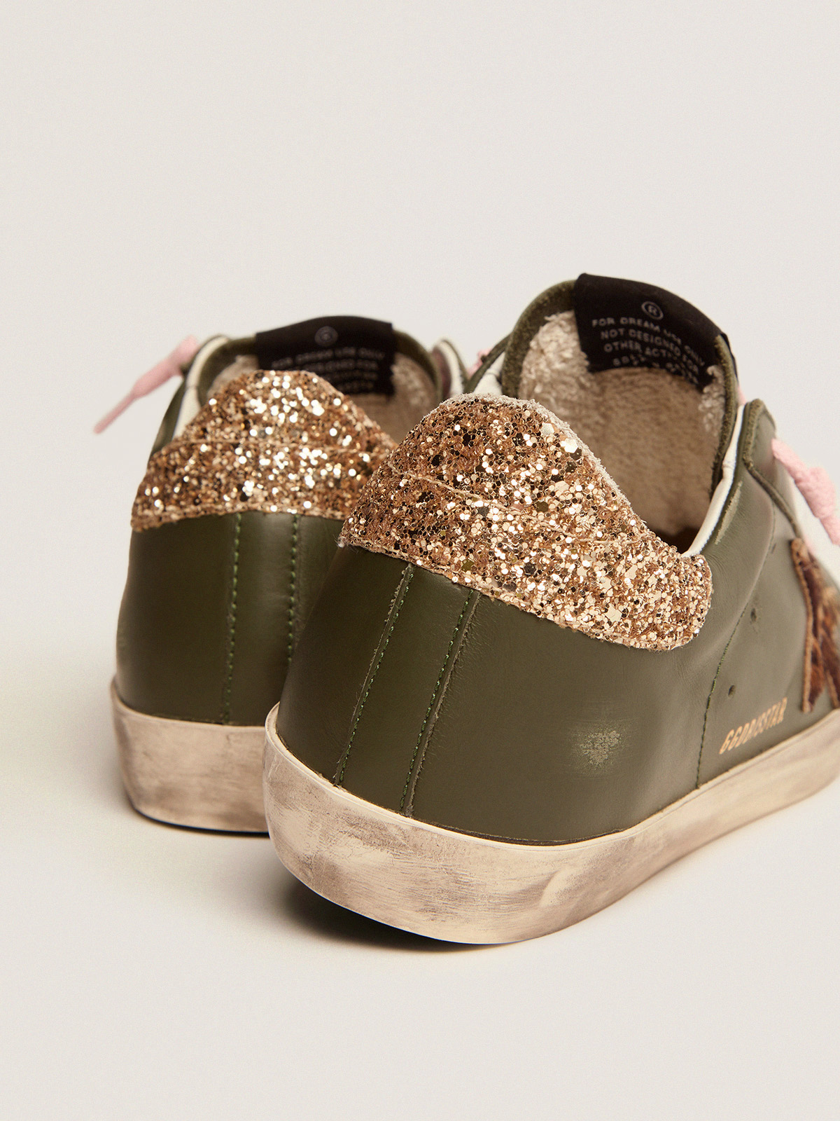 Super-Star sneakers in dark green leather with gold glitter heel 