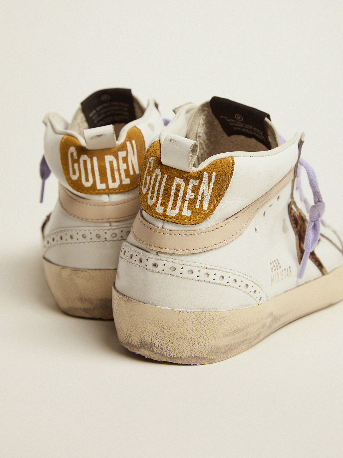 Mid Star sneakers with pony skin star and orange heel tab | Golden Goose