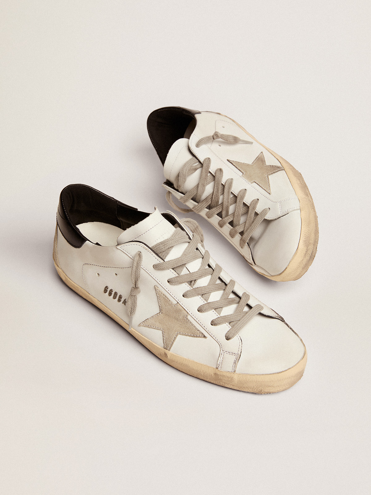 Golden goose cheap black superstar sneakers