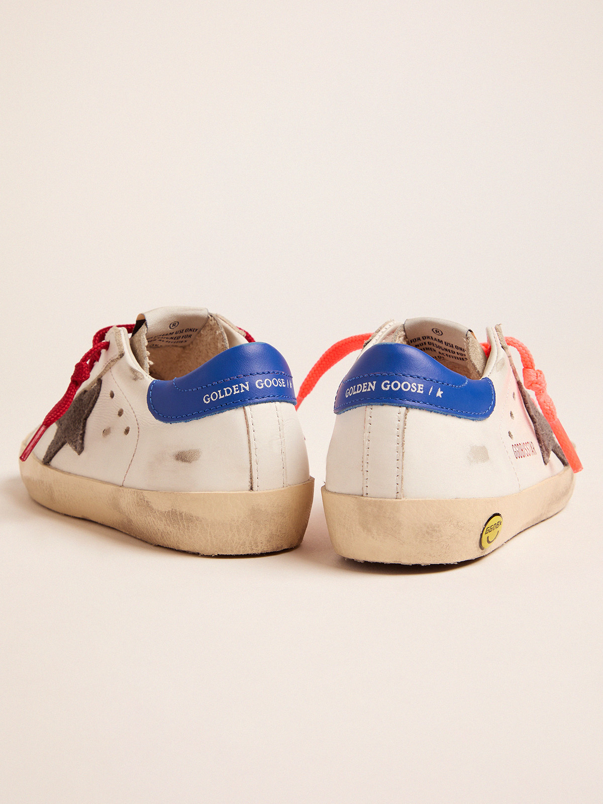 golden goose with red laces