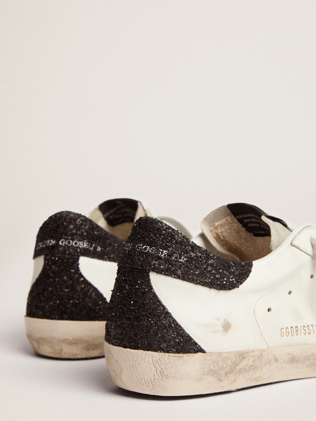 Women\'s Super-Star with gold star and black glitter heel tab | Golden Goose