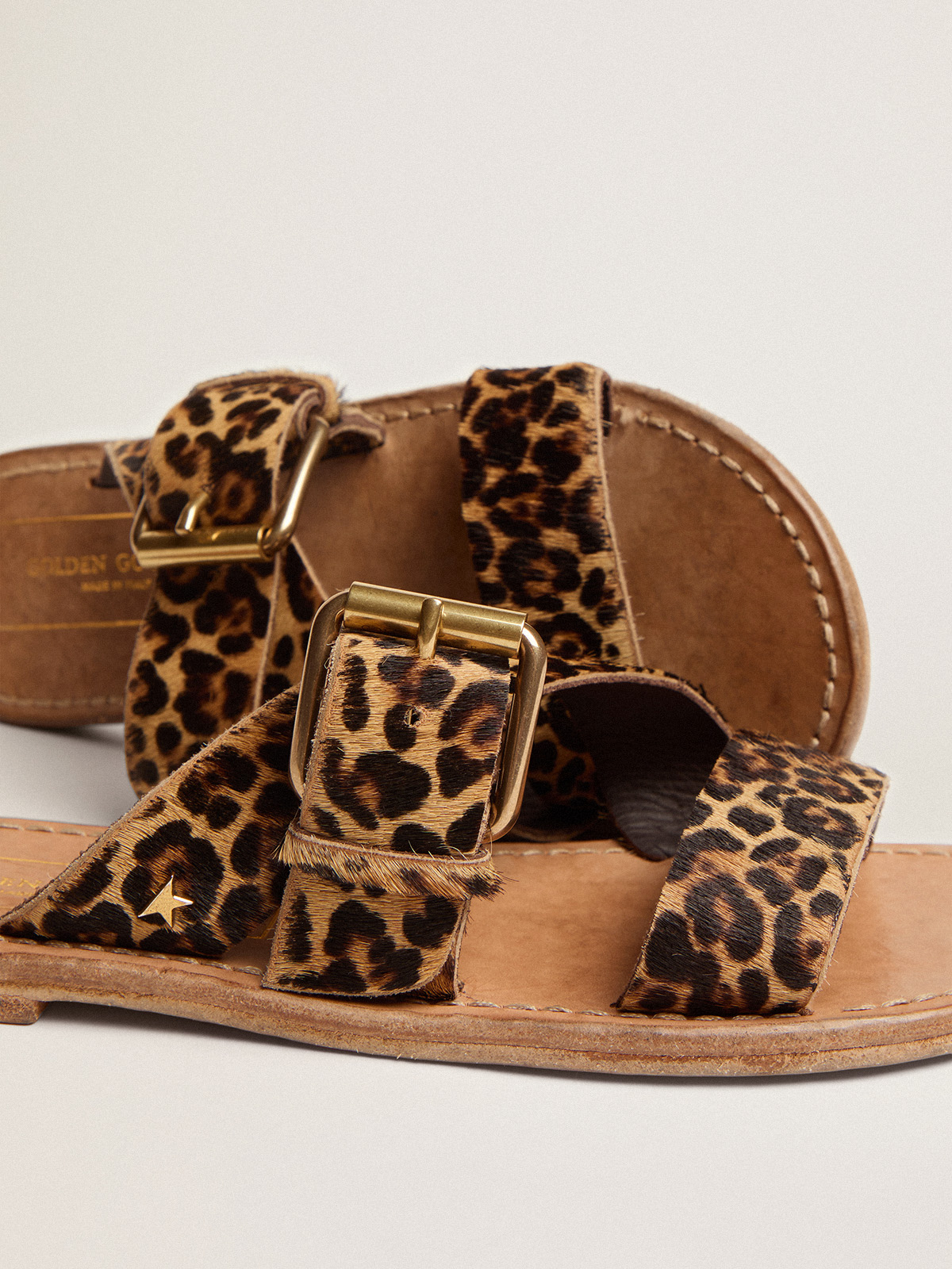 Animal print store leather flat sandals