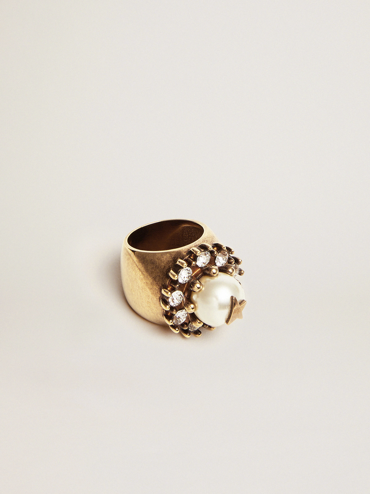 Women's ring in old gold color with decorative bead and crystals