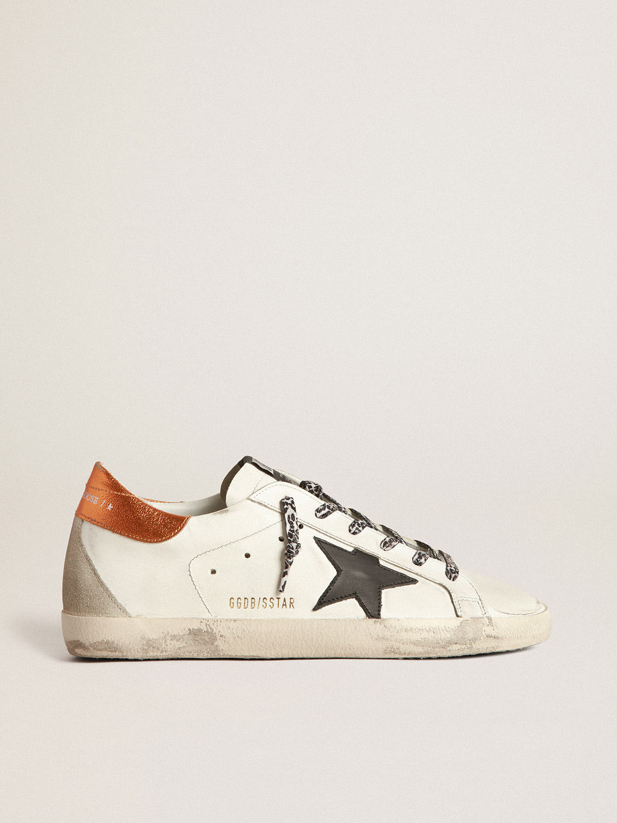 White Super-Star sneakers with black star and leopard-print laces