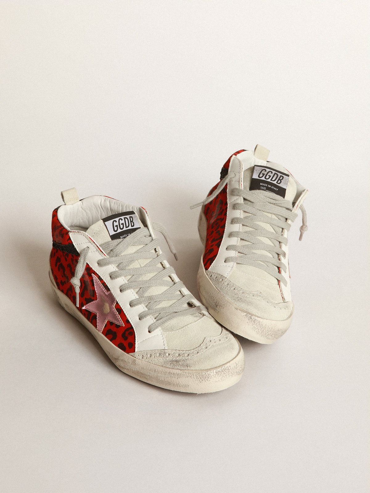 Mid Star sneakers in red leopard-print suede with pink laminated leather  star and black glitter flash | Golden Goose