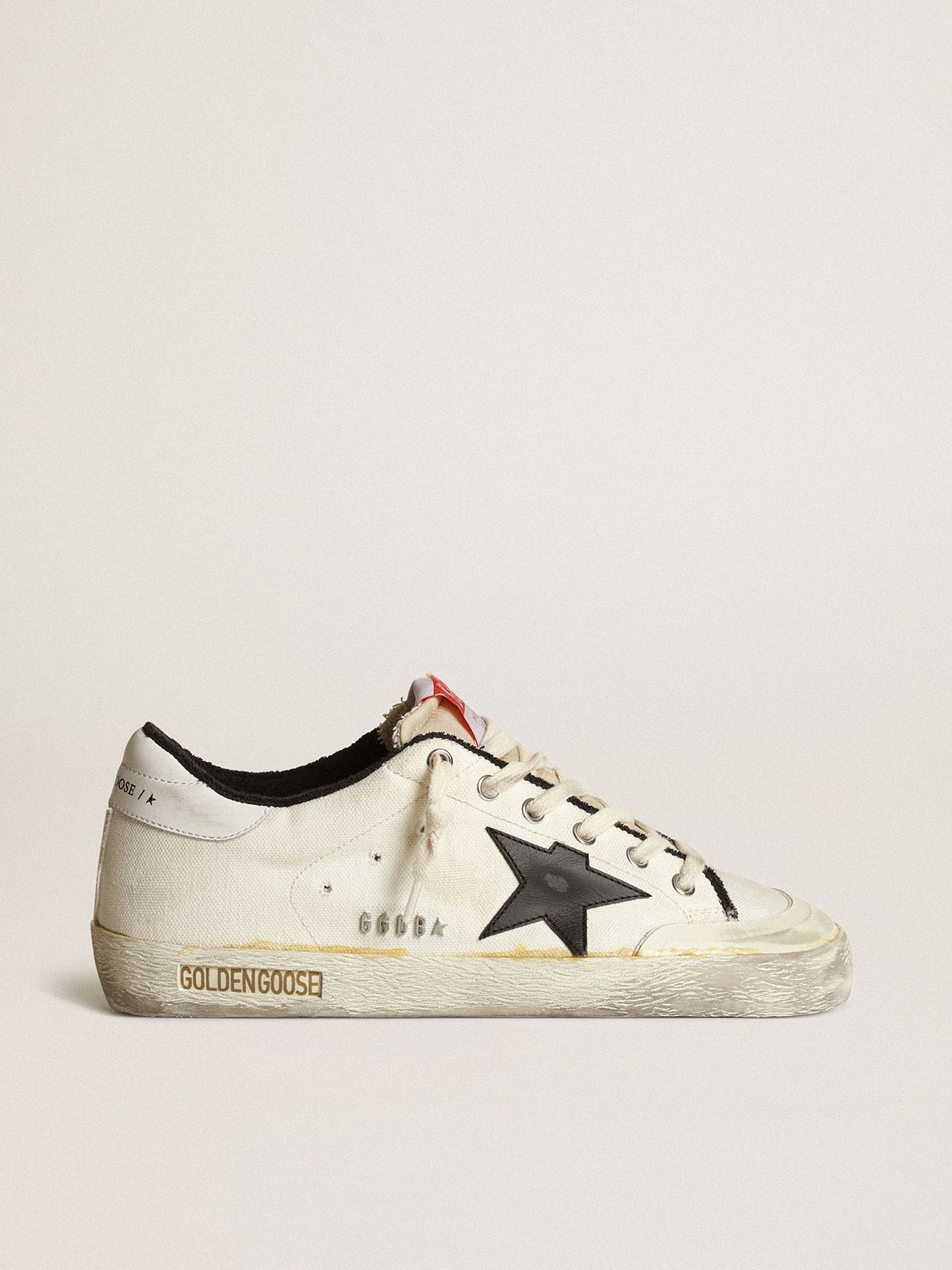 Dureza ventaja champán Men's Super-Star LTD sneakers in beige canvas with black leather star and  white leather heel tab | Golden Goose