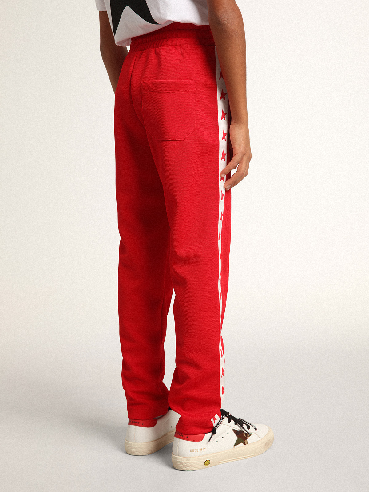 Red joggers with white stripe with contrasting red stars