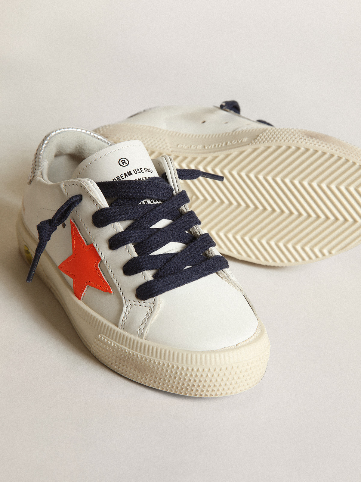 Young May with fluorescent orange leather star and perforated heel 