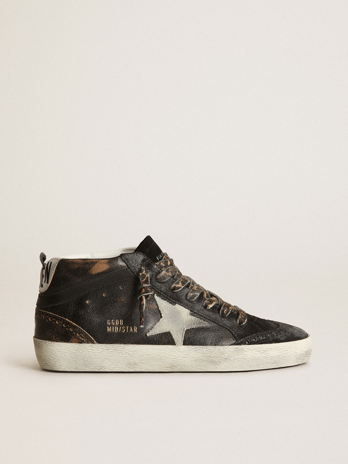 Golden goose black store mid star sneakers