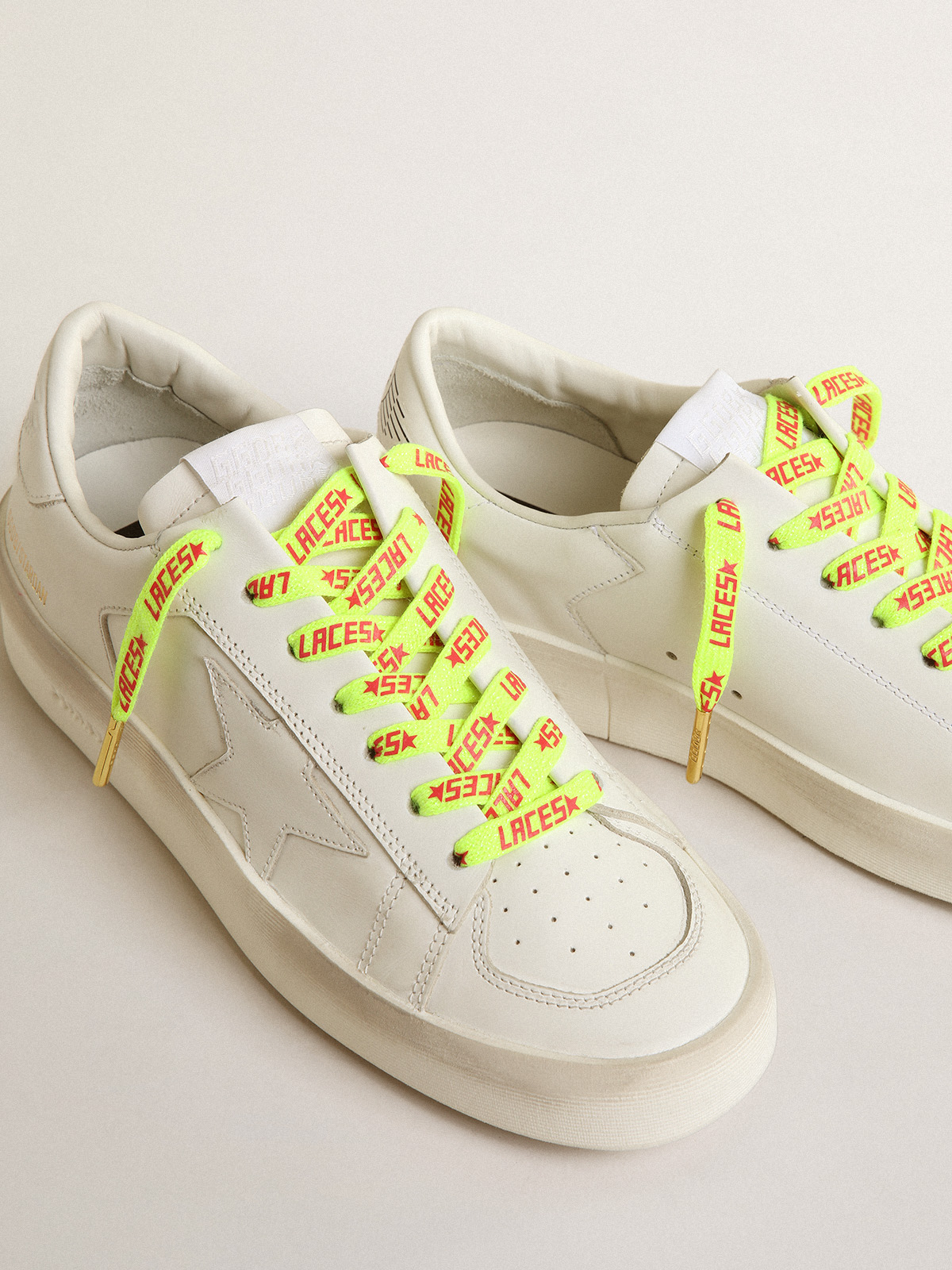 Fluorescent yellow laces with contrasting orange 'Laces' lettering