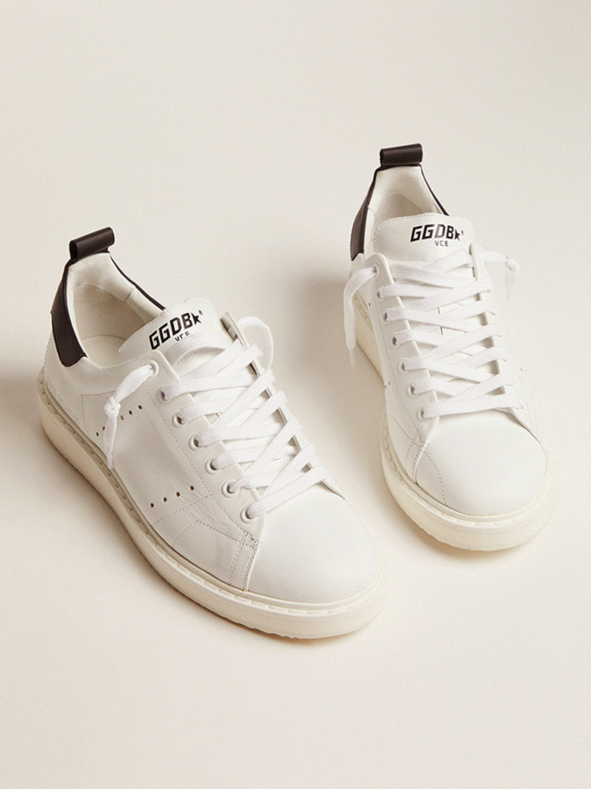 White sneakers with outlet black heel