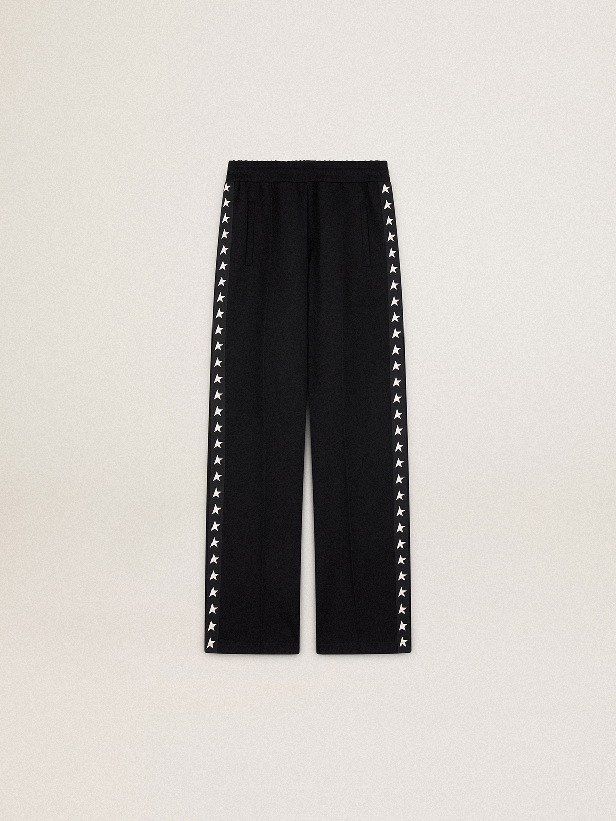 Women's black joggers with white stars on the sides