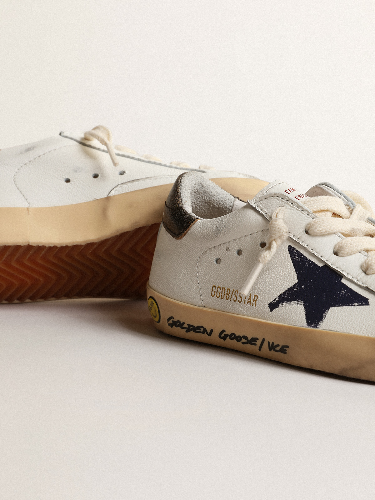 Super Star Junior in nappa with a printed star and black heel tab