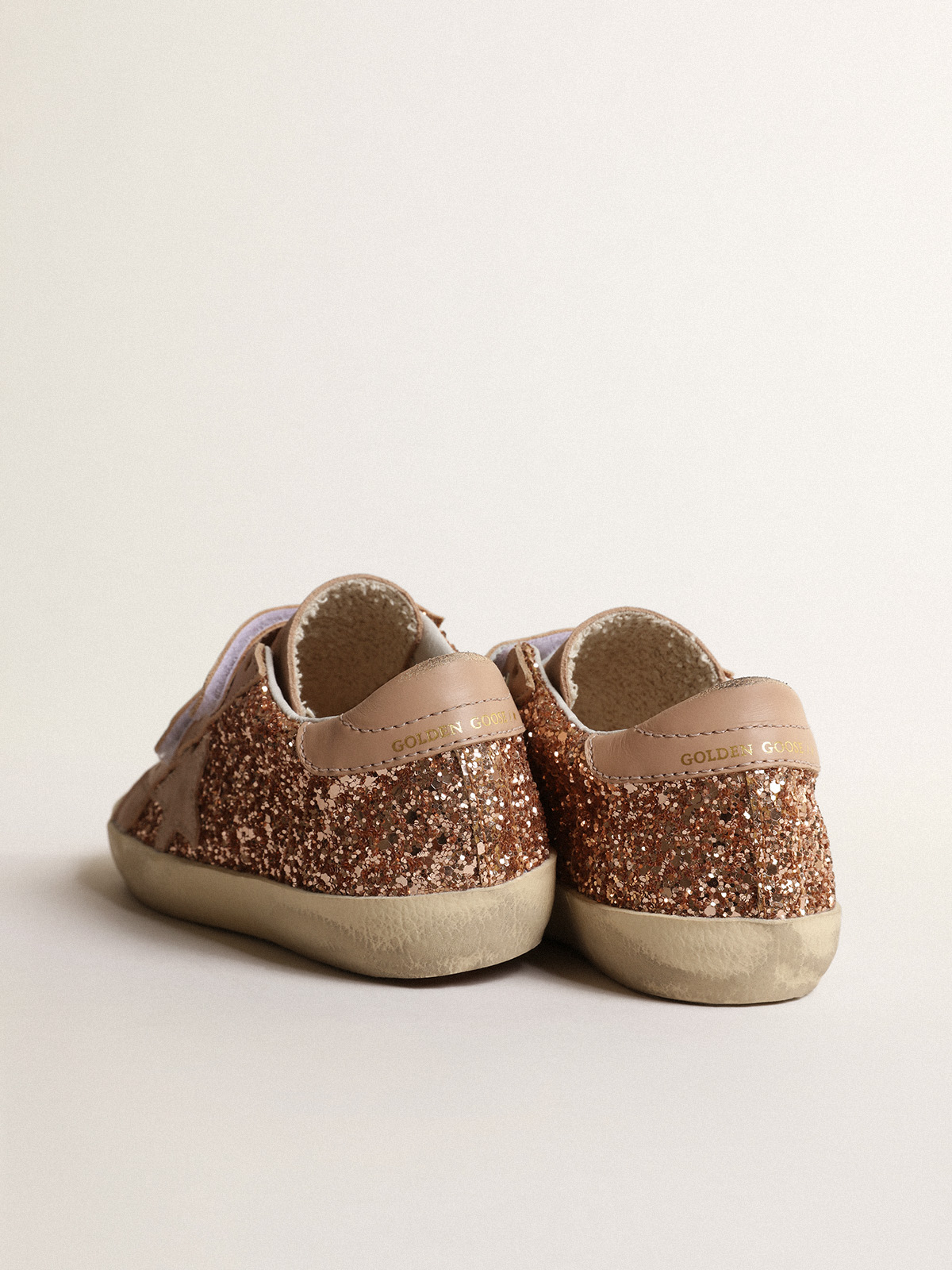 Old School Young in peach-pink glitter with pink suede star