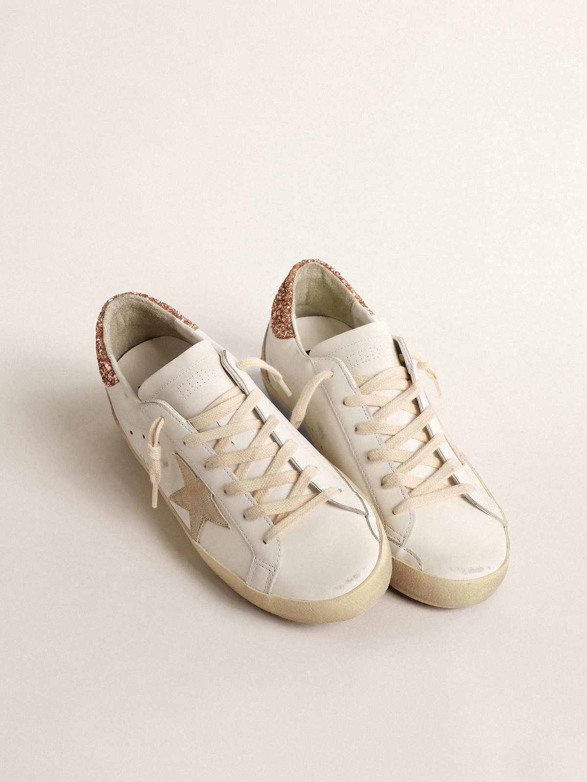 Women\'s Super-Star with a suede star and peach-pink glitter heel tab |  Golden Goose