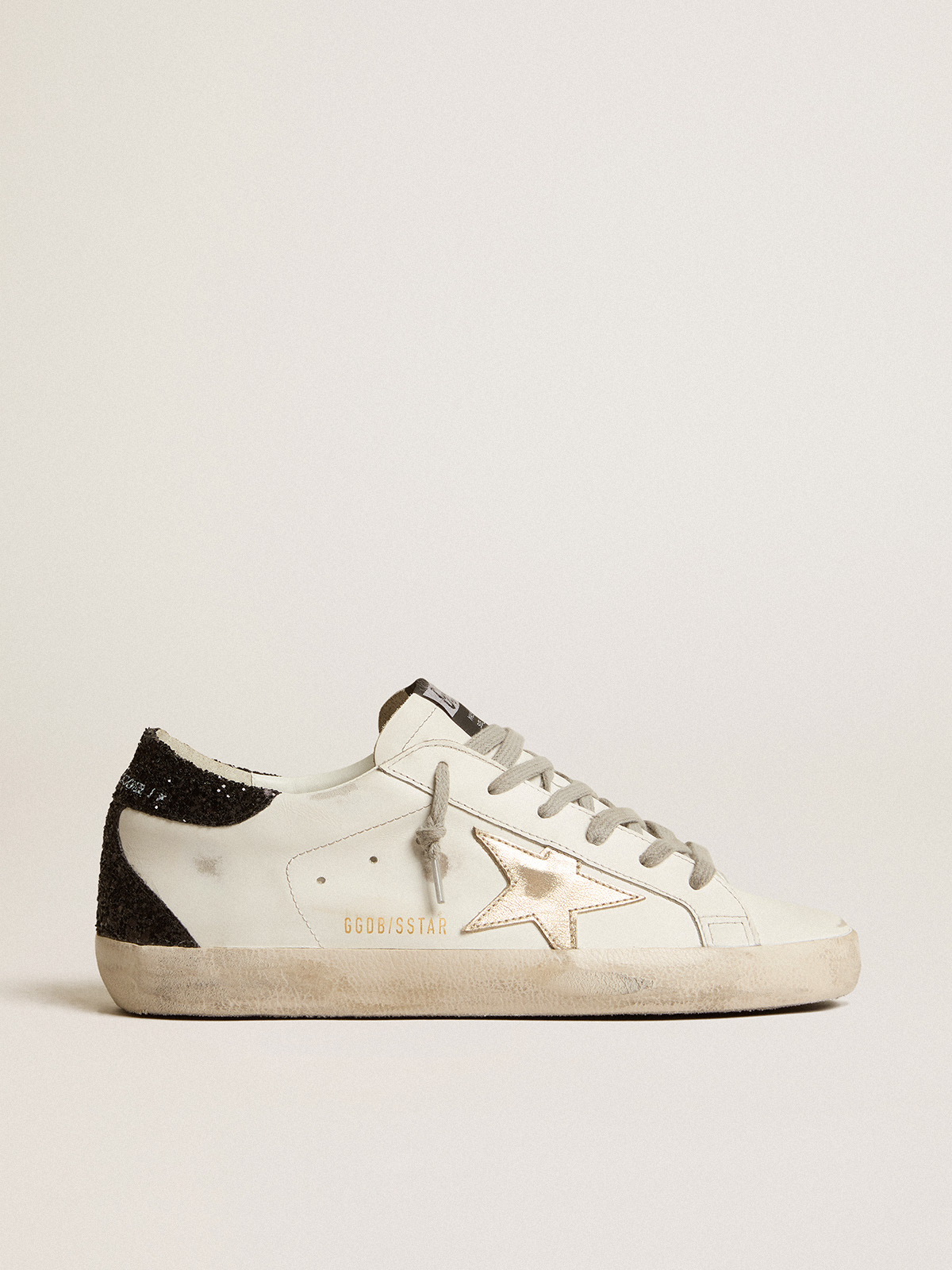 Women\'s Super-Star with gold star and black glitter heel tab | Golden Goose