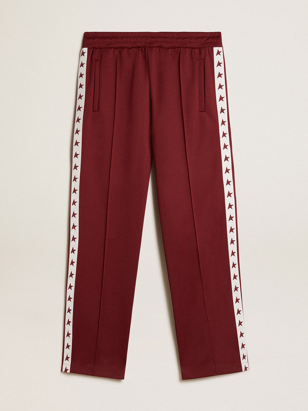 Red joggers with white stripe with contrasting red stars