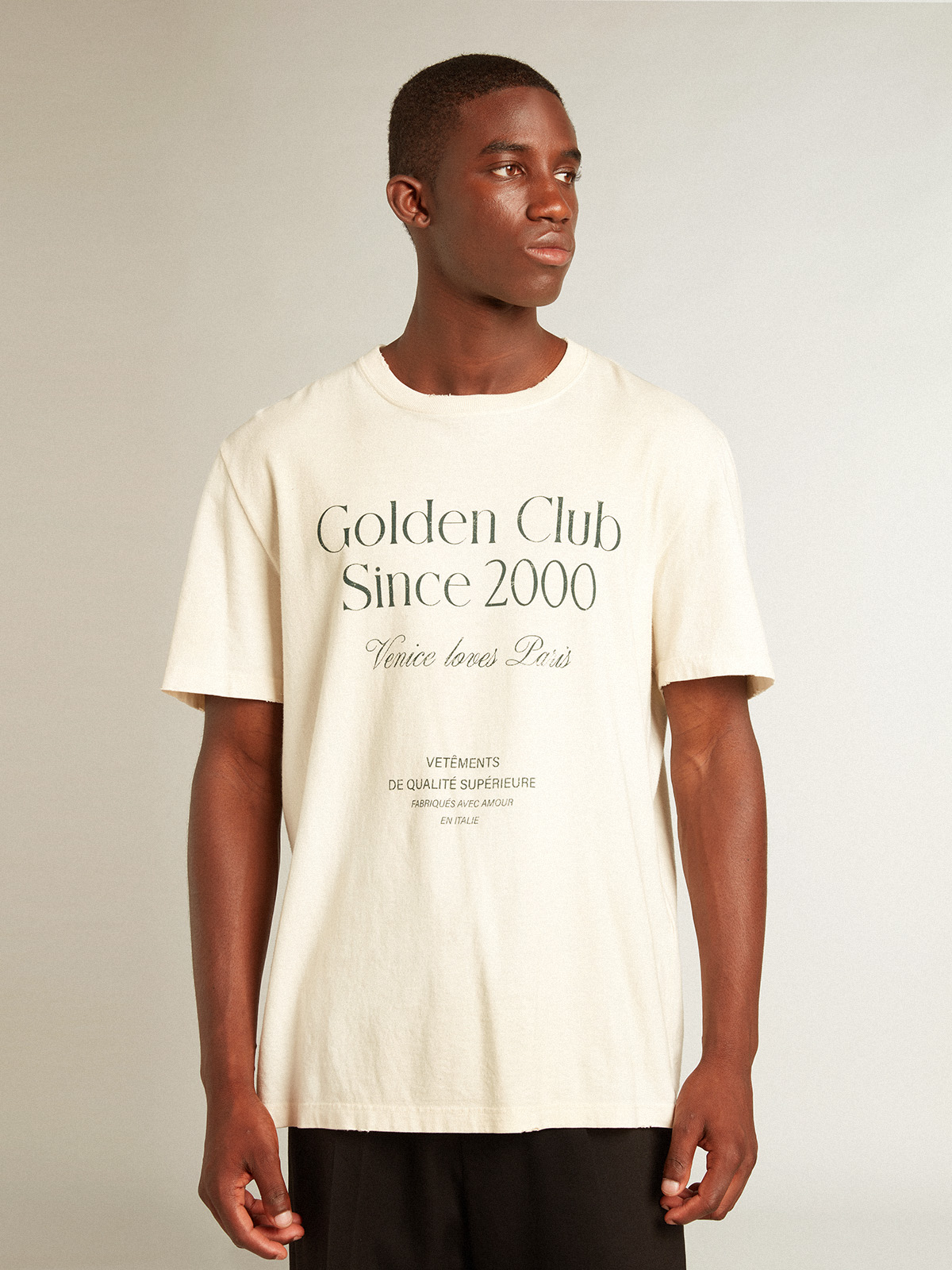 Men s cotton T shirt in aged white with green lettering Golden Goose