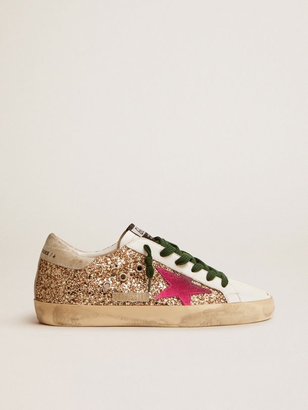 Golden Goose - Super-Star sneakers in gold glitter with fluorescent pink suede star in 