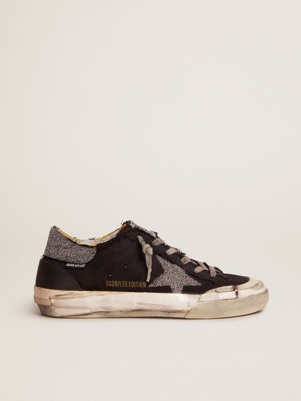Super-Star Penstar LAB sneakers in black distressed canvas with crystal star and heel tab    
