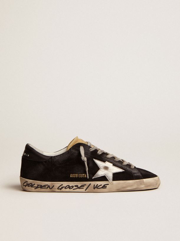 Sneakers Super-Star en daim noir avec étoile en cuir lamé argenté et contrefort en cuir noir