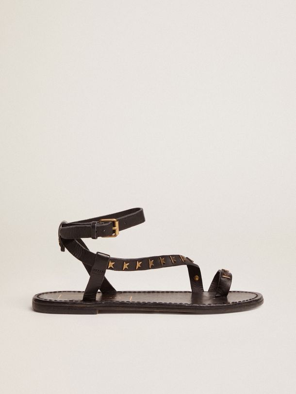 Golden Goose - Janis flat sandals in black leather with gold stars in 