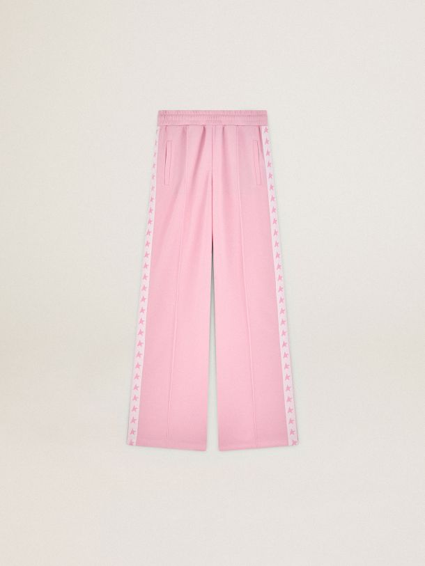 两侧饰有粉色星星图案的女款粉色慢跑裤