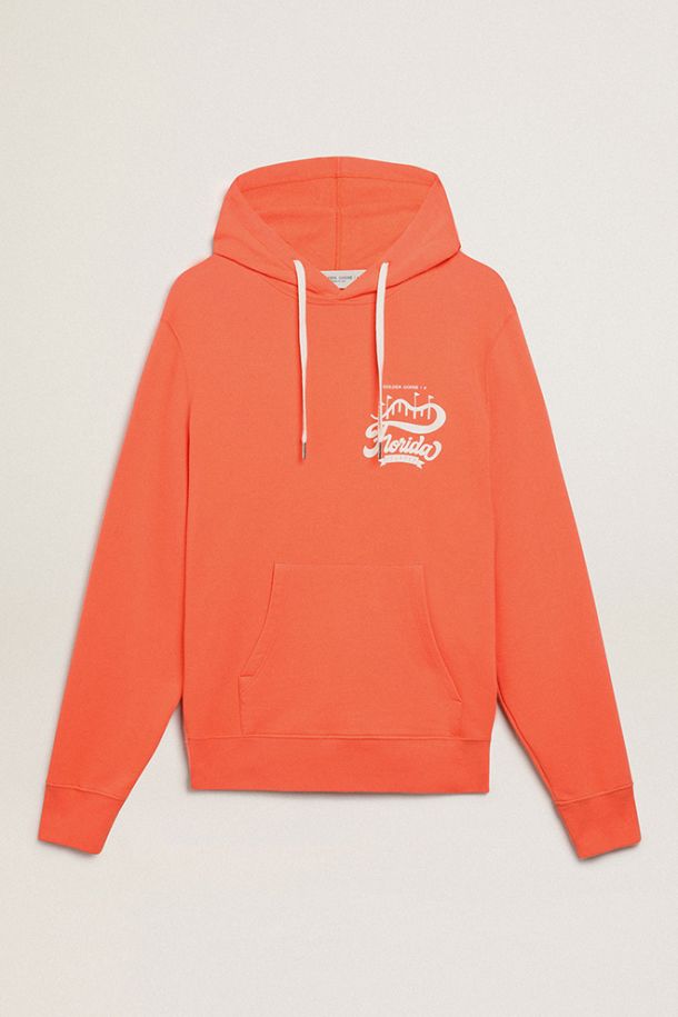Coral-colored Journey Collection sweatshirt with double white print on the back