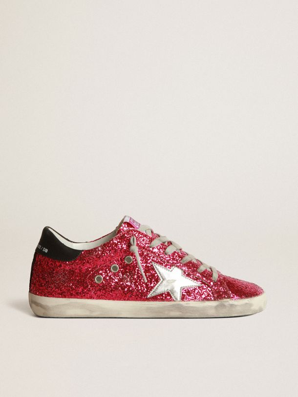 Golden Goose - Sneaker Super-Star in glitter fucsia con stella in pelle laminata color argento in 