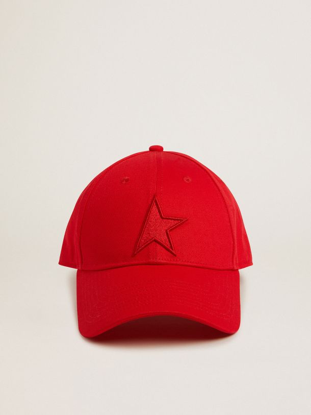 Red cotton baseball cap with tone-on-tone star-shaped patch on the front