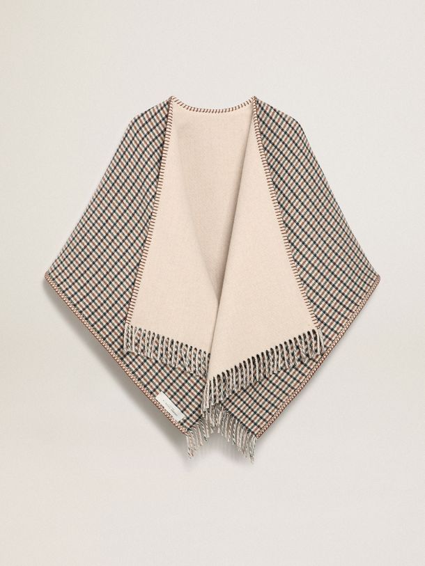 Poncho in reversible cream-colored wool with check pattern and contrasting ‘Golden’ lettering